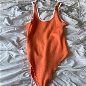 Orange body suit